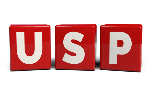 3D word USP in white on red blocks stands for what your company does differently.