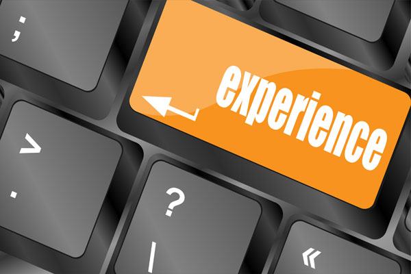 Word experience in orange on computer keyboard key.
