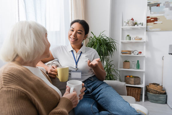 Caregiver using casual tone of voice with older client.