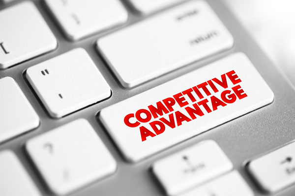 Computer and computer key with competitive advantage text on it.