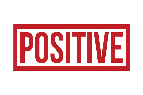 Red word positive on white background.