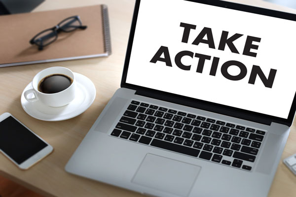 Take action text on laptop computer screen.