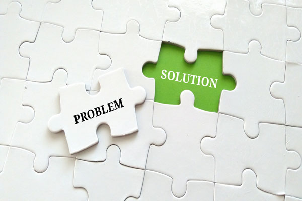 Puzzle with problem text and solution text on two pieces.
