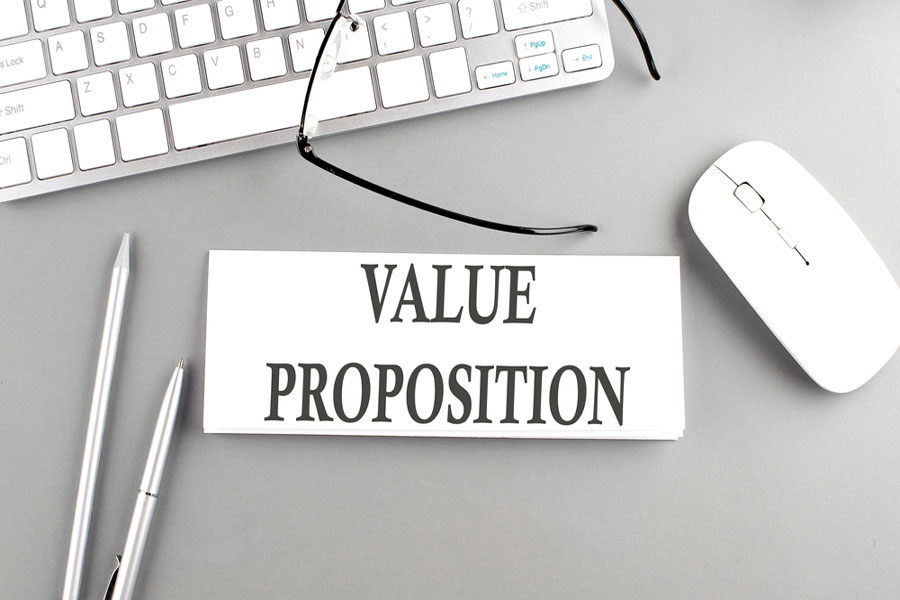 Value proposition text on paper in front of keyboard.