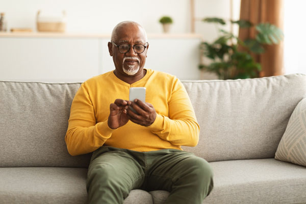 Older man calling on his cellphone.