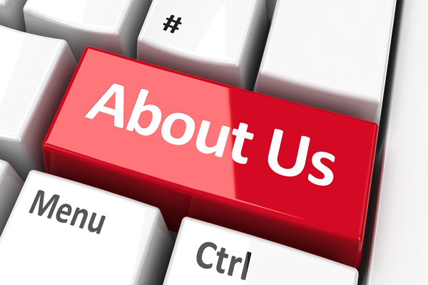 Keyboard with words About Us on computer key.