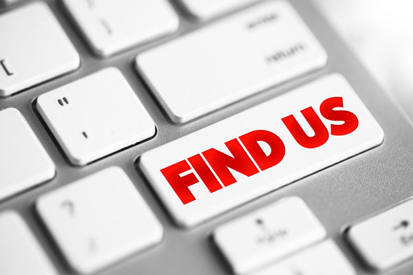 Keyboard with words find us on computer key.